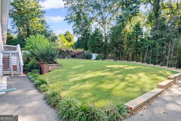 a view of a swimming pool with chairs