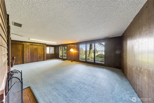 a view of a room with window and stairs