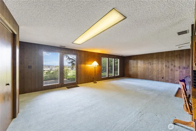 a view of a room with window and chandelier