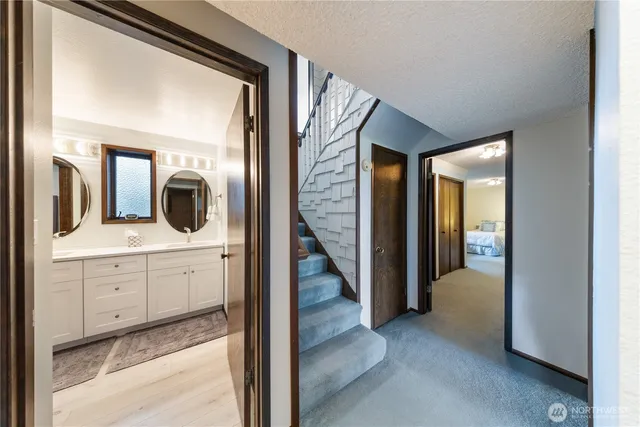 a view of a hallway view with staircase