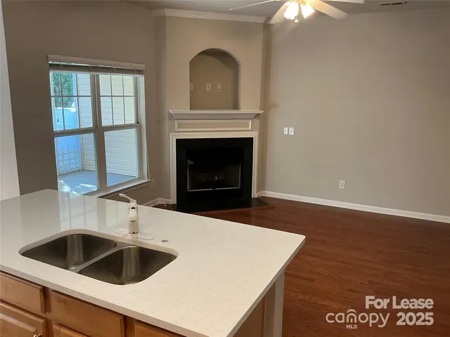 a kitchen with a sink and a stove
