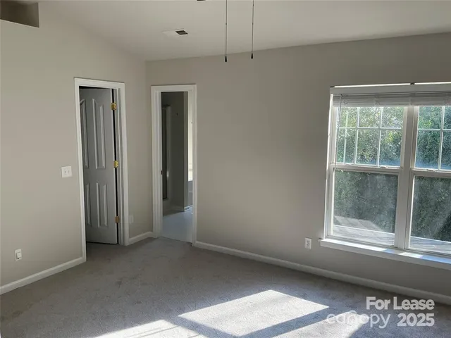 a view of a room that has a window in it