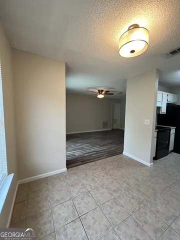 an empty room with a bathroom