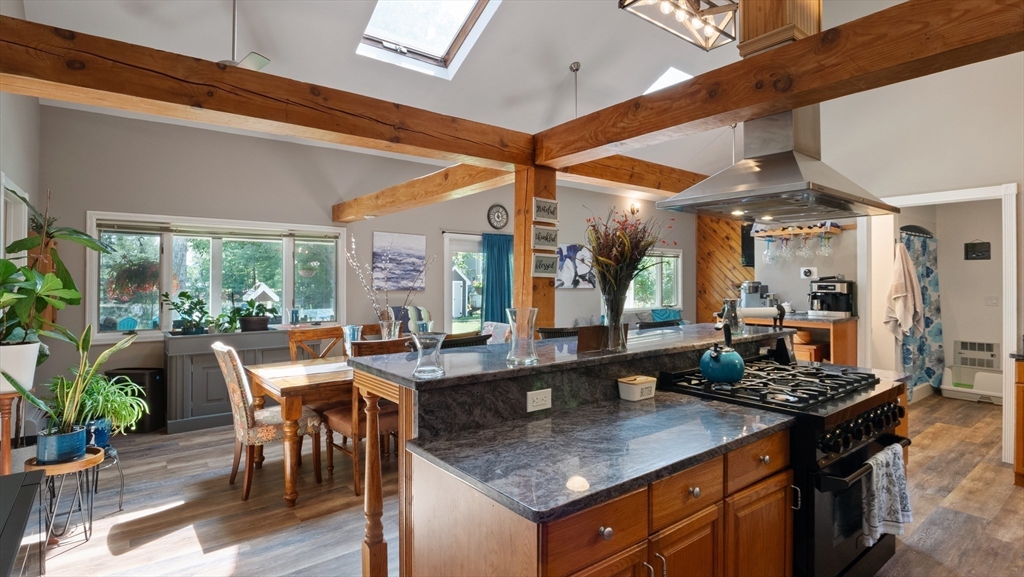 16 Sandy Cove Road Lunenburg, MA 01462 - Photo 21 of 38 a kitchen with counter top space and dining table