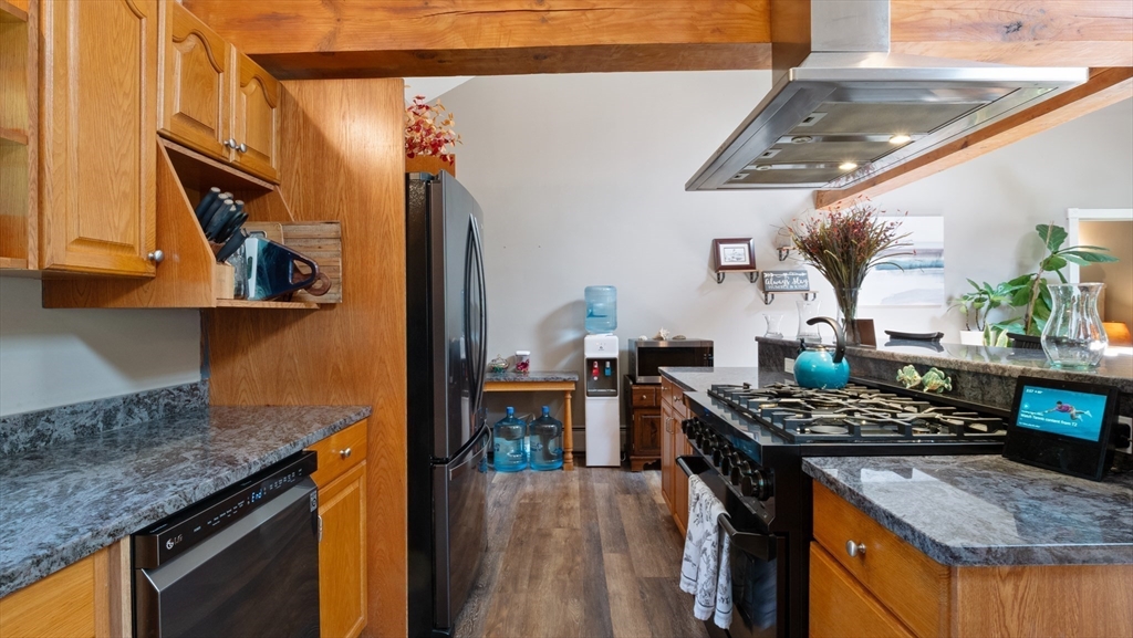 16 Sandy Cove Road Lunenburg, MA 01462 - Photo 23 of 38 a kitchen with stainless steel appliances granite countertop a stove and a sink