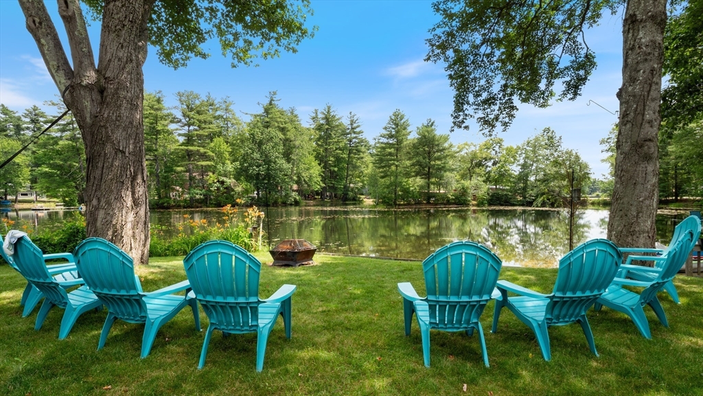 16 Sandy Cove Road Lunenburg, MA 01462 - Photo 7 of 38 a view of a chair and table in the garden