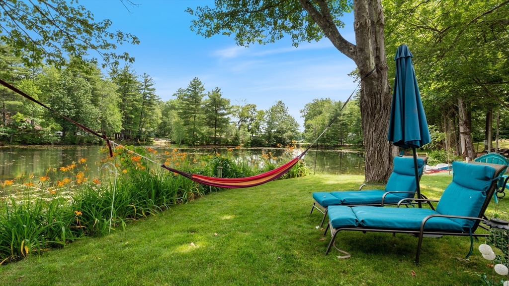 16 Sandy Cove Road Lunenburg, MA 01462 - Photo 8 of 38 a view of a swimming pool with a lounge chair