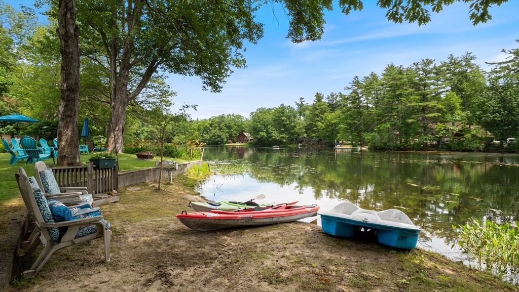 16 Sandy Cove Road Lunenburg, MA 01462 - Photo 9 of 38 a view of a lake with lawn chairs