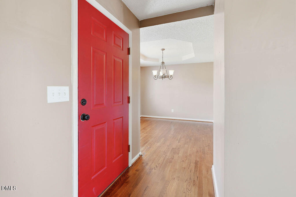 1560 Cane Mill Road Coats, NC 27521 - Photo 6 of 32 a view of a hallway with wooden floor