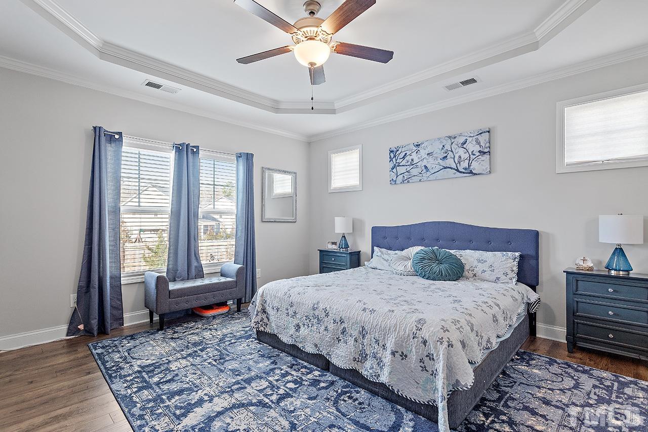 196 Fairview Street Clayton, NC 27520 - Photo 12 of 21 a bedroom with a large bed and a window