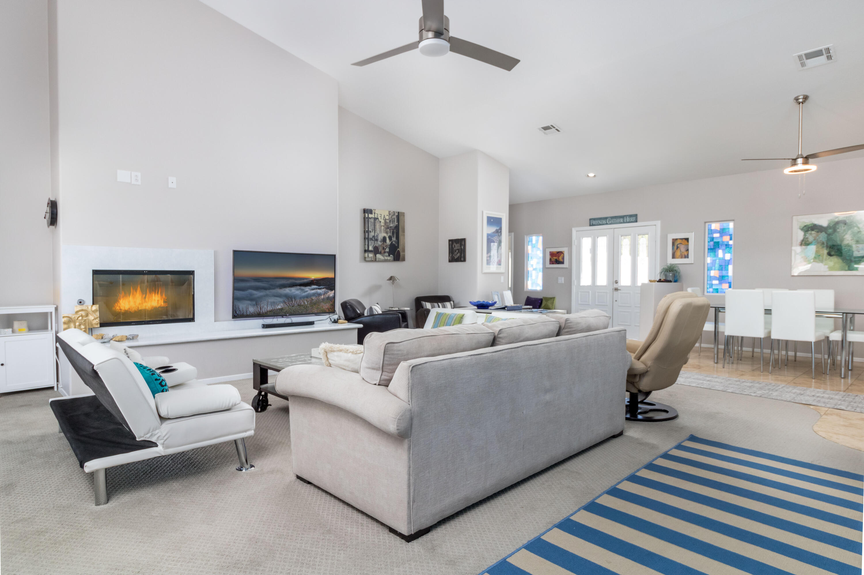 12753 Mountain View Road Desert Hot Springs, CA 92240 - Photo 12 of 45 a living room with furniture and a flat screen tv