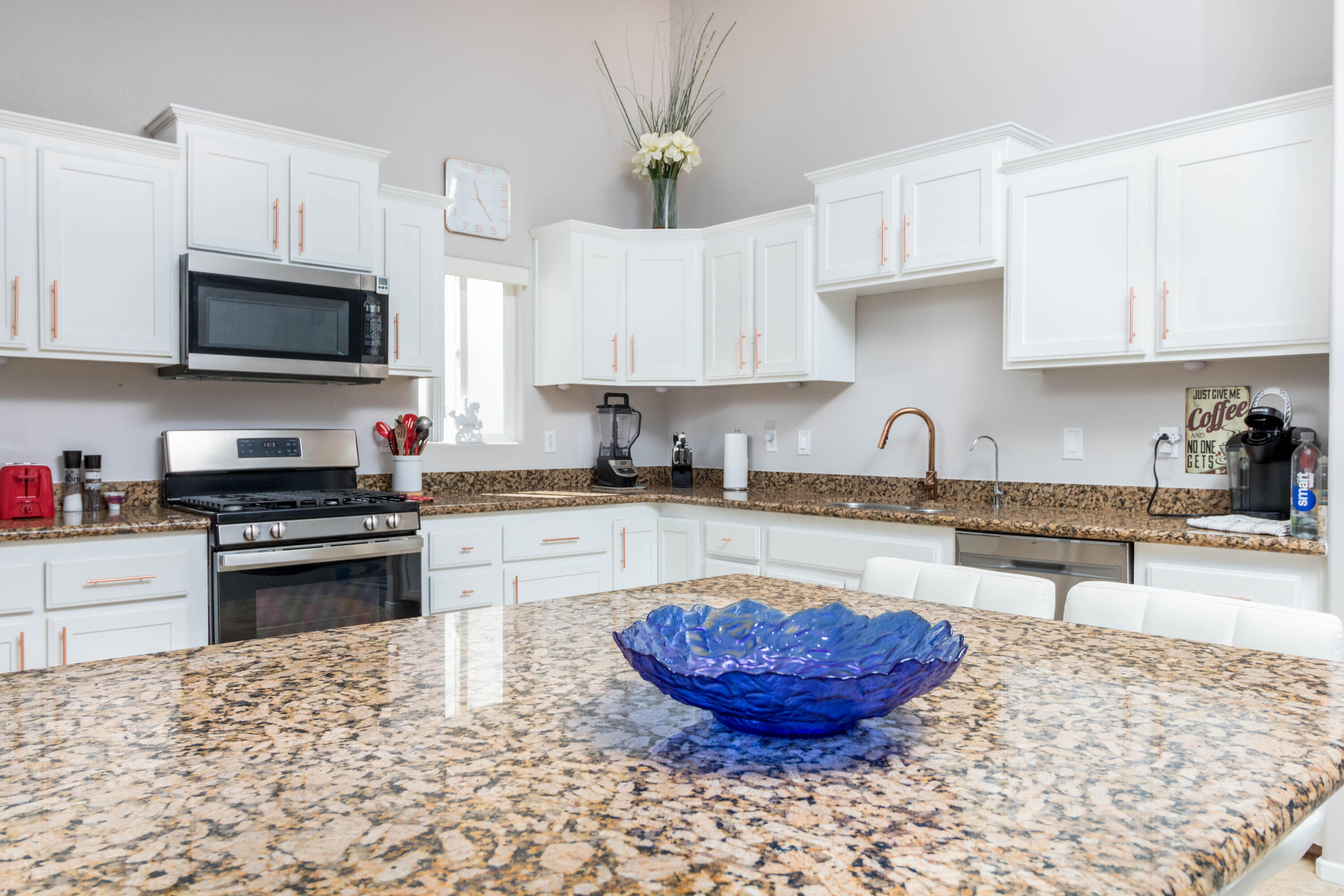 12753 Mountain View Road Desert Hot Springs, CA 92240 - Photo 16 of 45 a kitchen with stainless steel appliances granite countertop a sink stove and microwave