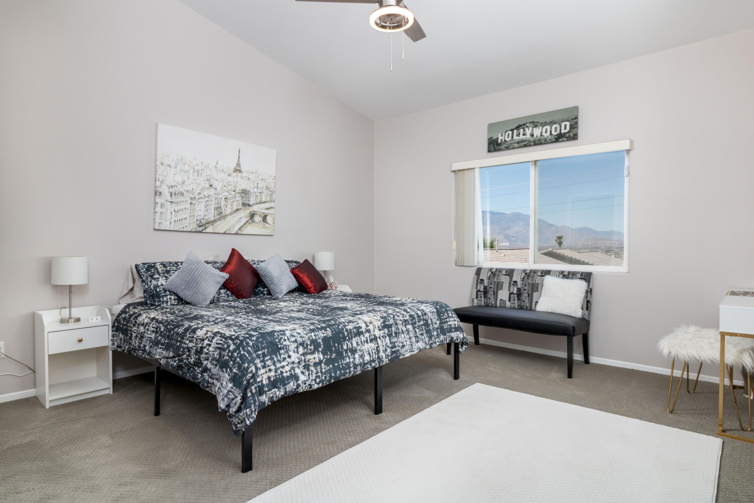 12753 Mountain View Road Desert Hot Springs, CA 92240 - Photo 21 of 45 a bedroom with a bed and a table in it