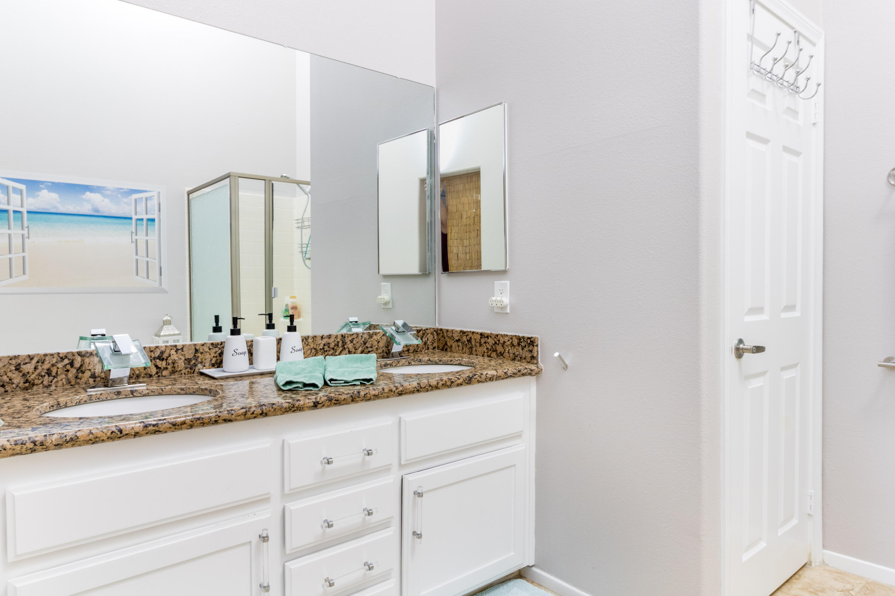 12753 Mountain View Road Desert Hot Springs, CA 92240 - Photo 23 of 45 a bathroom with a granite countertop sink and a mirror