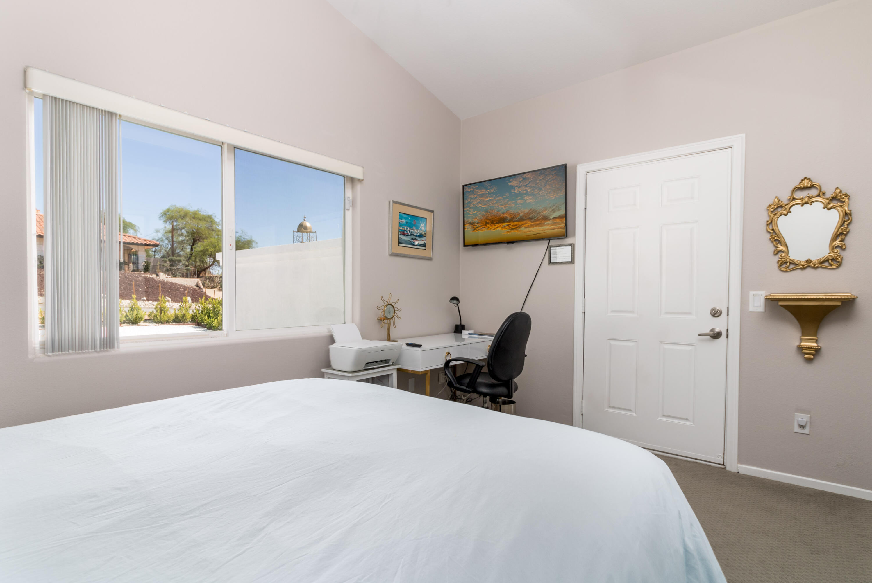 12753 Mountain View Road Desert Hot Springs, CA 92240 - Photo 28 of 45 a bedroom with a bed and painting on the wall