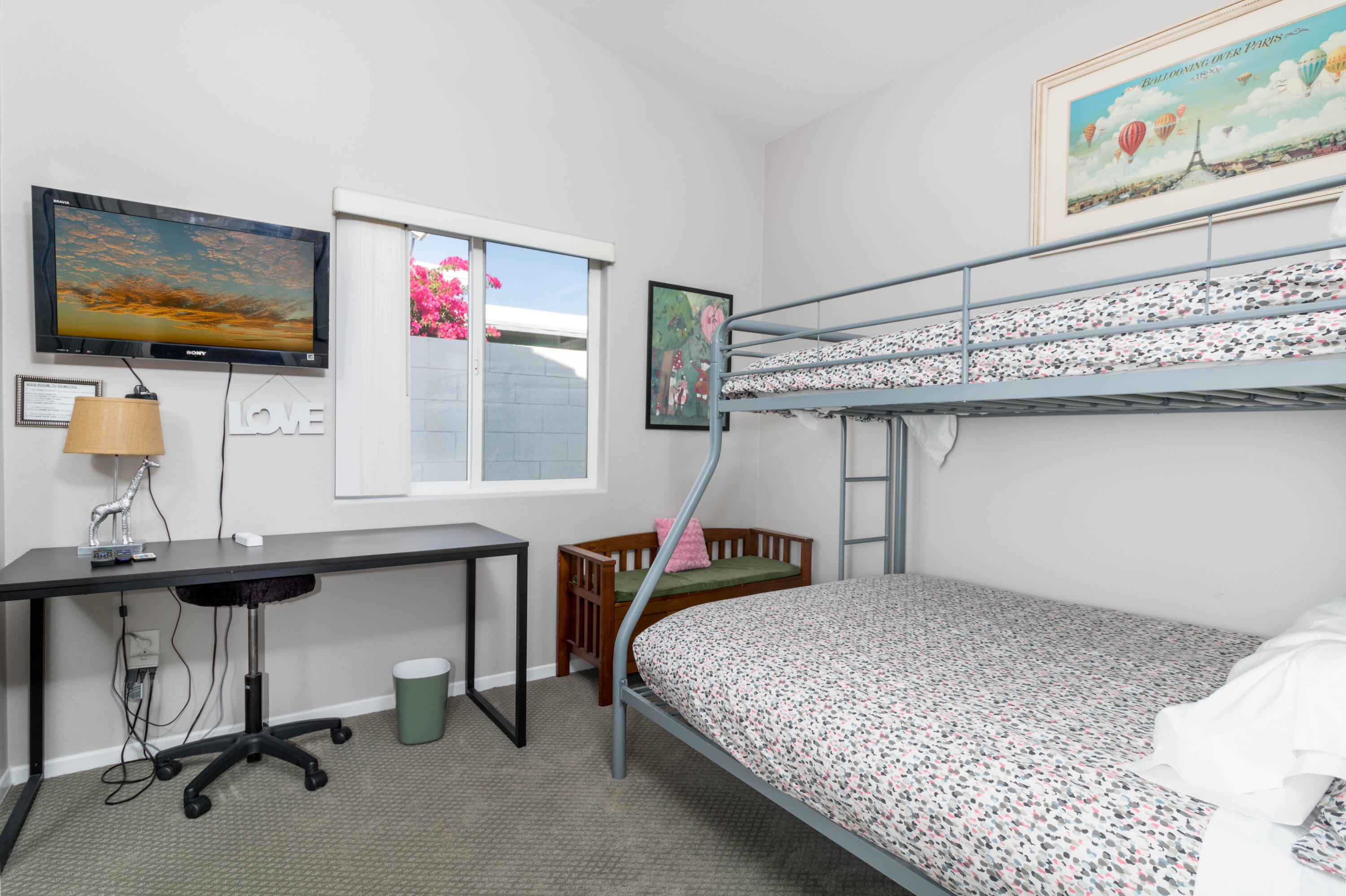 12753 Mountain View Road Desert Hot Springs, CA 92240 - Photo 29 of 45 a bedroom with a bed and a flat screen tv
