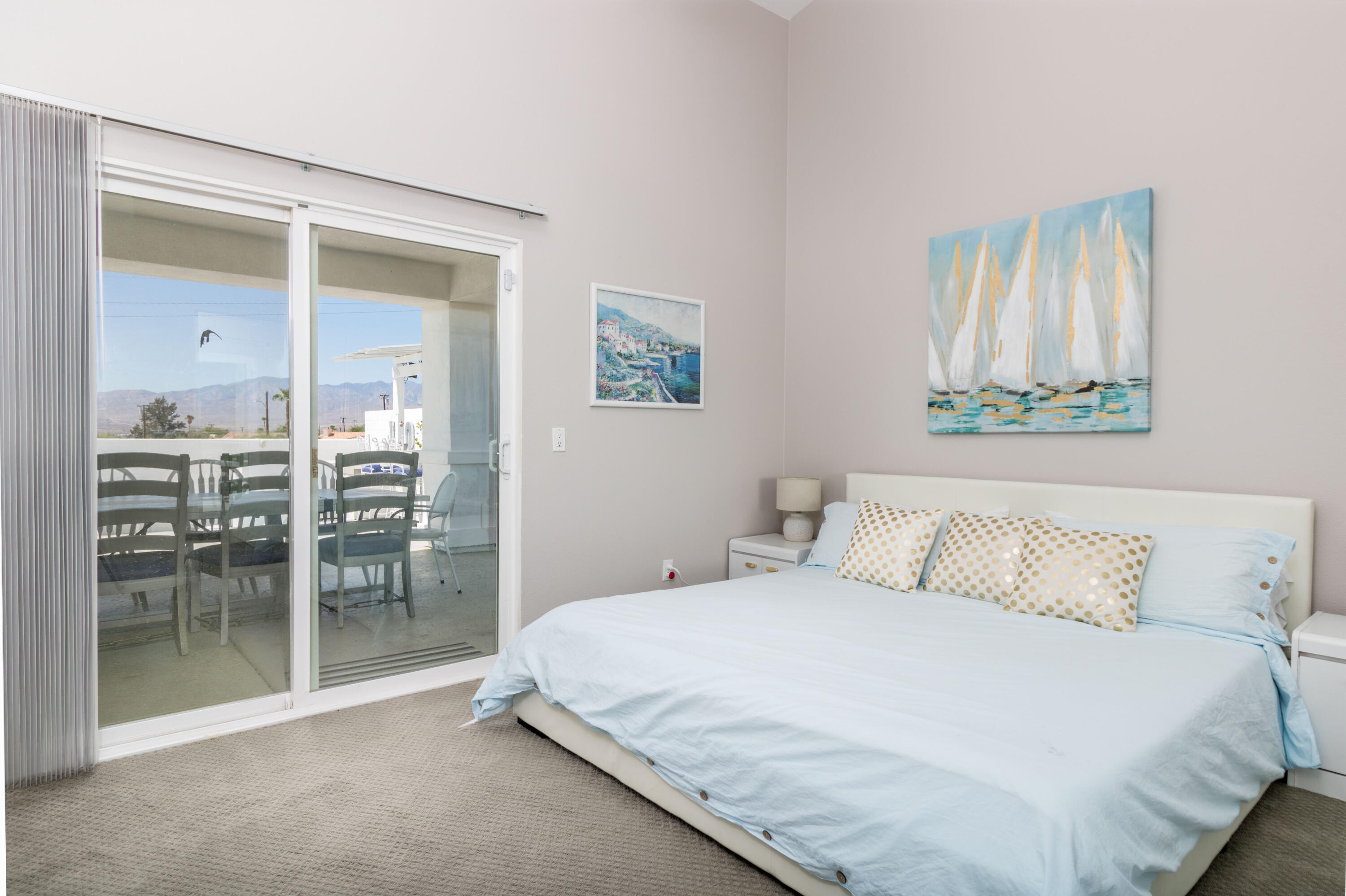12753 Mountain View Road Desert Hot Springs, CA 92240 - Photo 30 of 45 a bedroom with a bed and a table