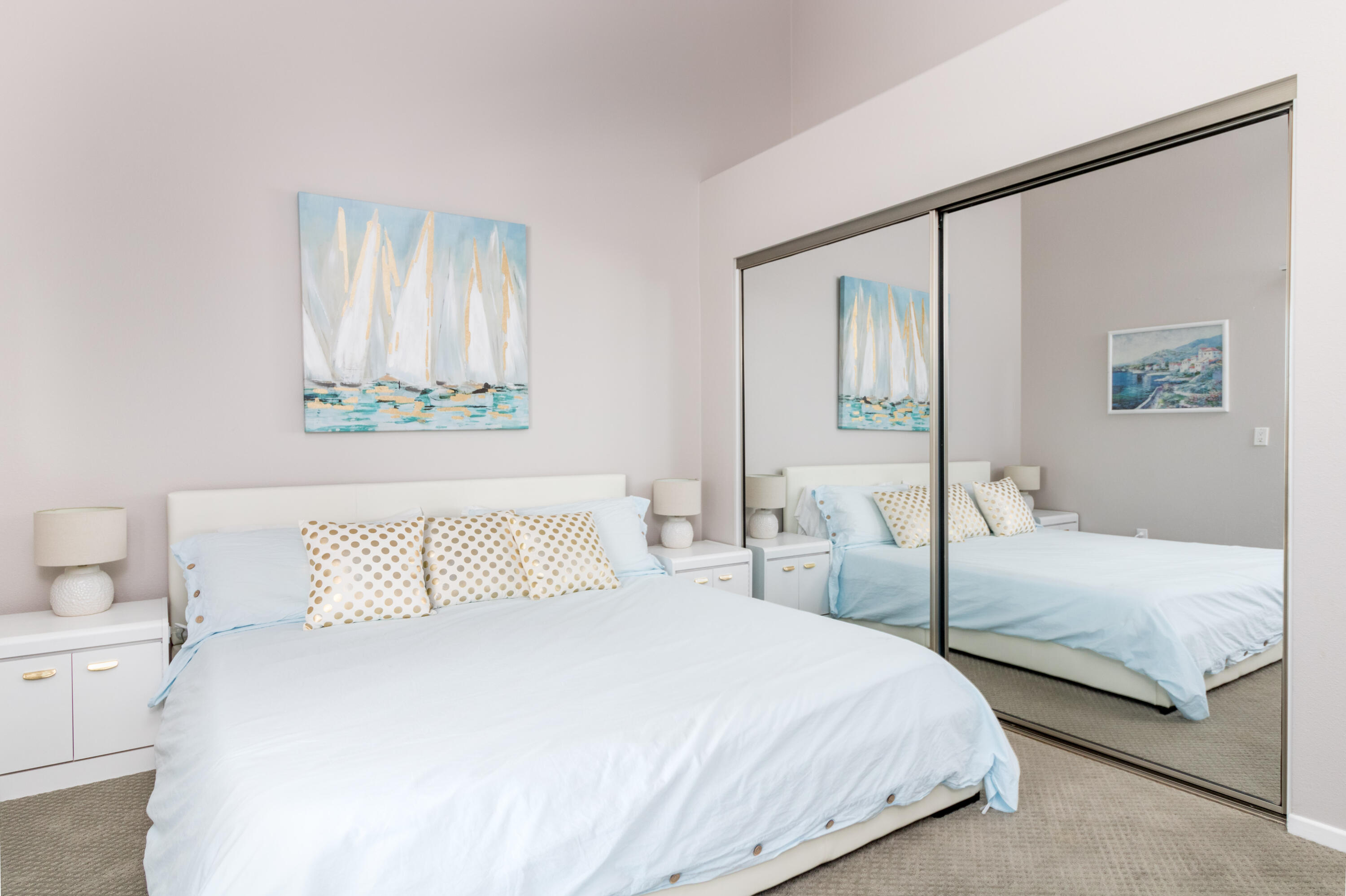 12753 Mountain View Road Desert Hot Springs, CA 92240 - Photo 31 of 45 a bedroom with a bed and a painting on the wall
