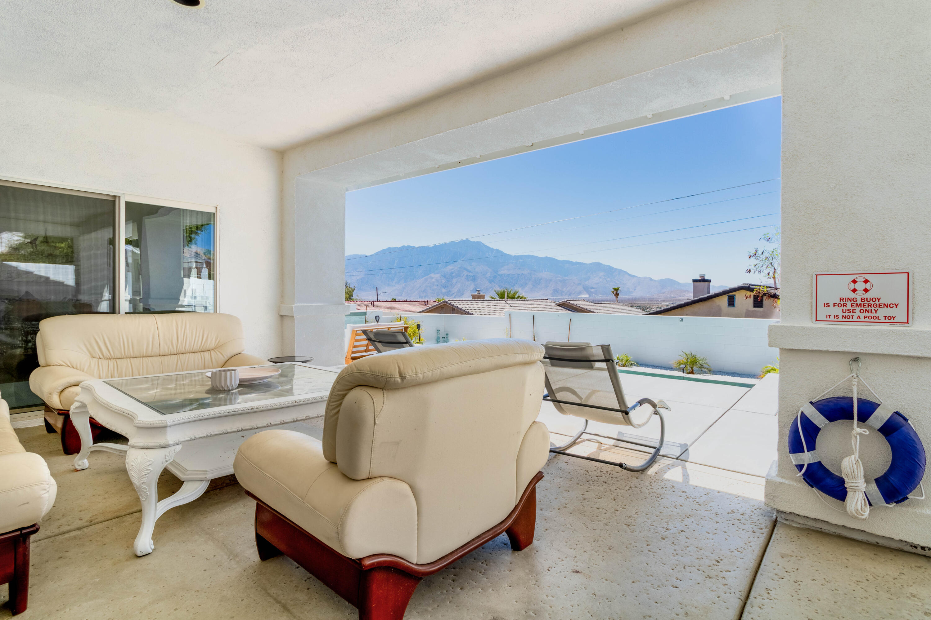 12753 Mountain View Road Desert Hot Springs, CA 92240 - Photo 35 of 45 a living room with furniture and a couch