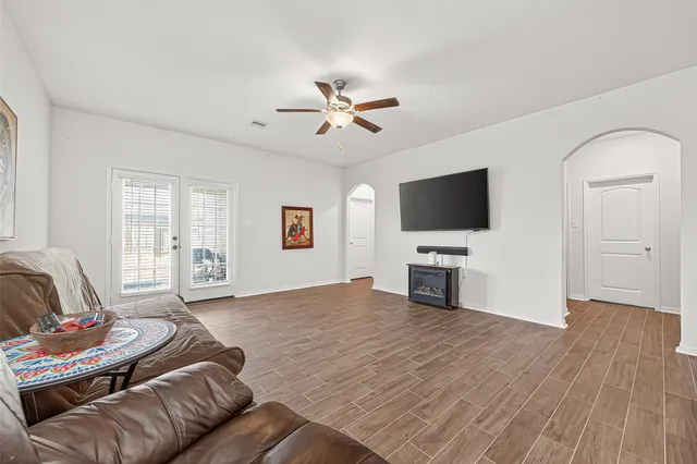 a living room with furniture and a flat screen tv