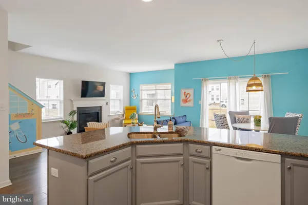 a kitchen with a sink stove and microwave