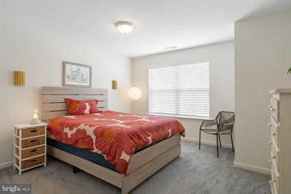 a bedroom with a bed and a closet