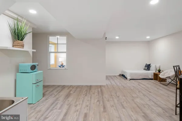 a bedroom with a bed and a table in it