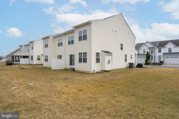 a view of a house with backyard of the house