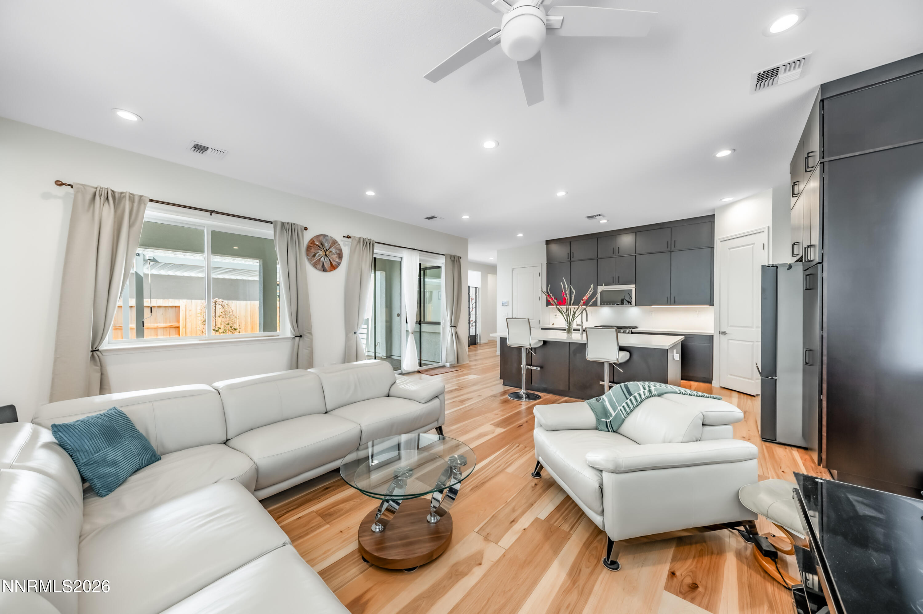 2402 Iron Square Drive Reno, NV 89521 - Photo 11 of 30 a living room with furniture and a large window