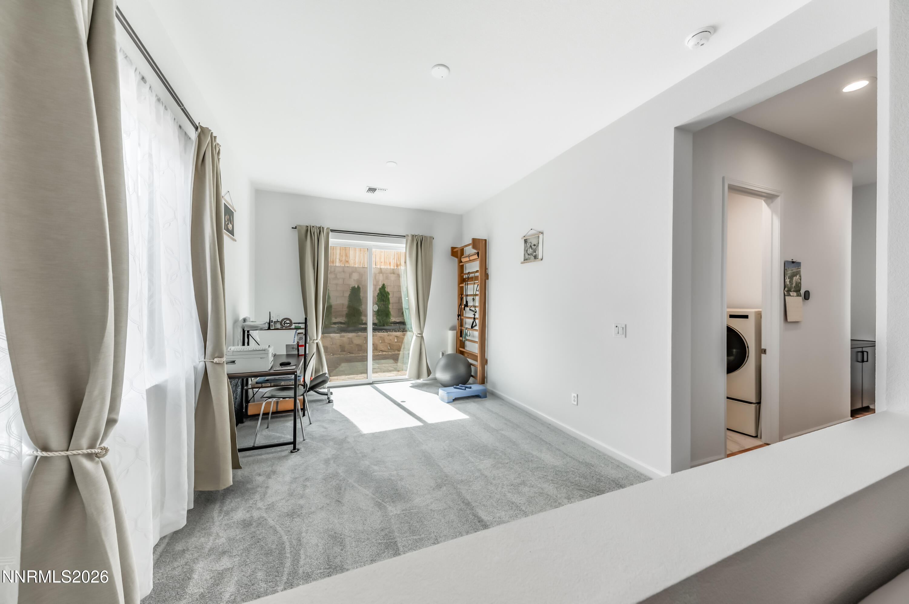 2402 Iron Square Drive Reno, NV 89521 - Photo 12 of 30 a living room with furniture and large windows
