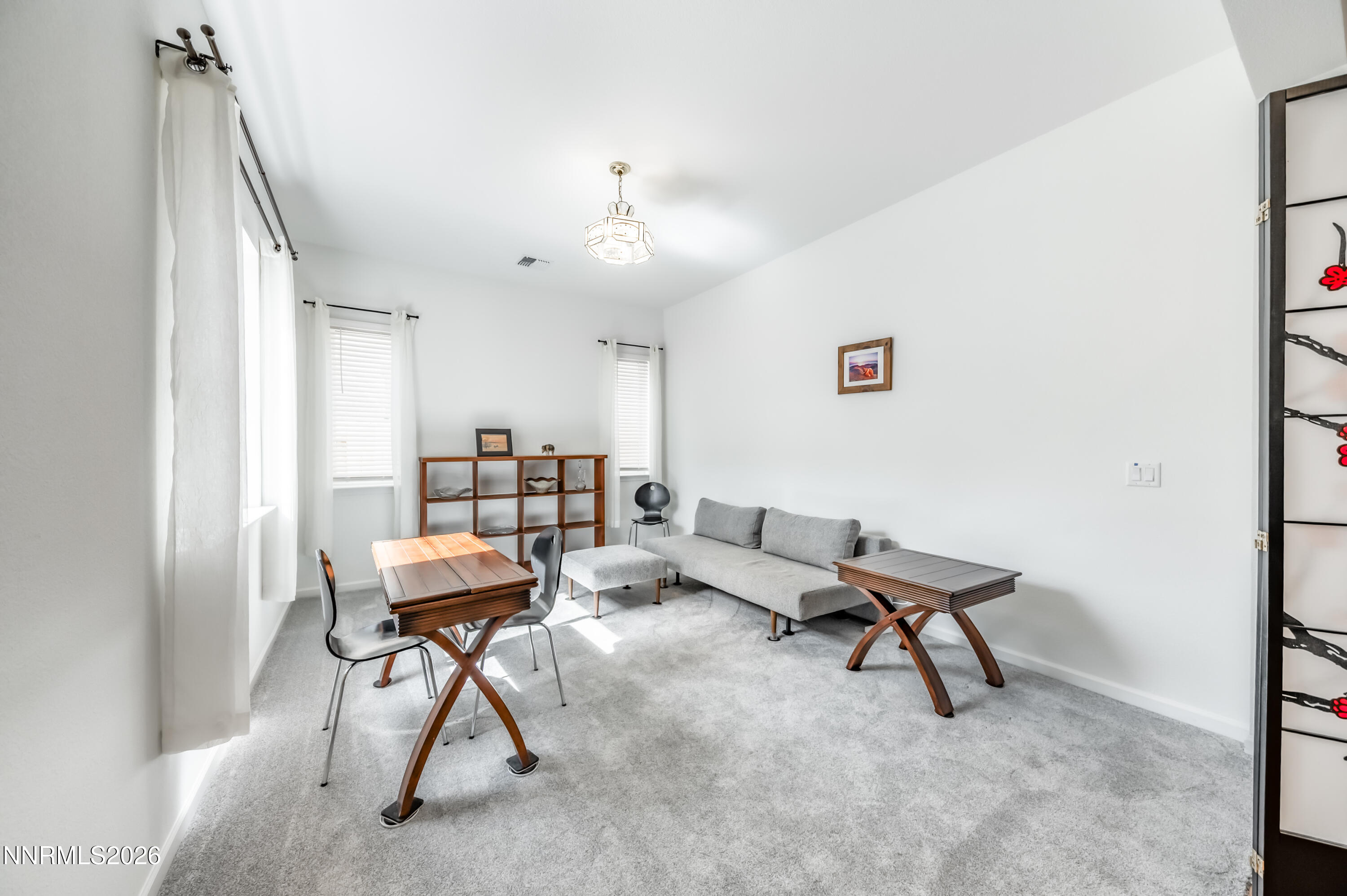 2402 Iron Square Drive Reno, NV 89521 - Photo 13 of 30 a workspace with furniture and a window