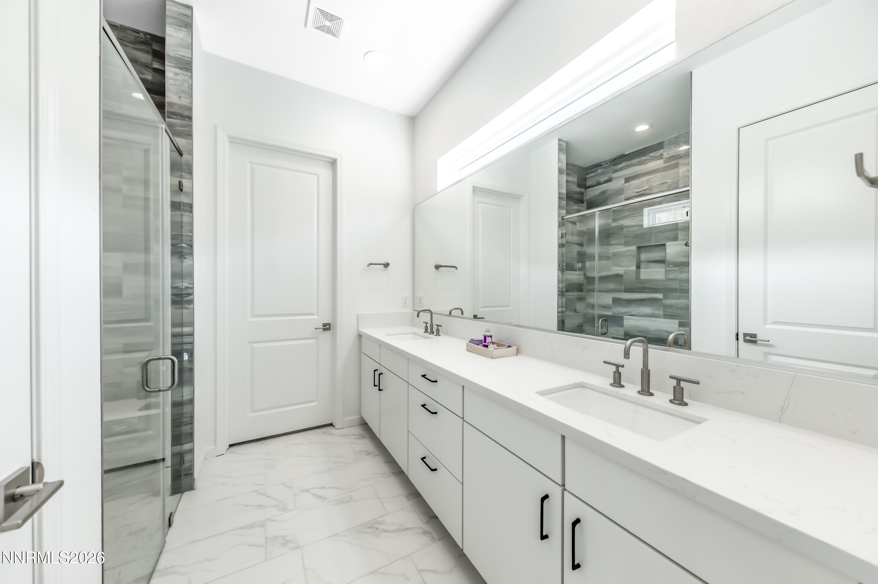 2402 Iron Square Drive Reno, NV 89521 - Photo 6 of 30 a bathroom with double sink and a mirror