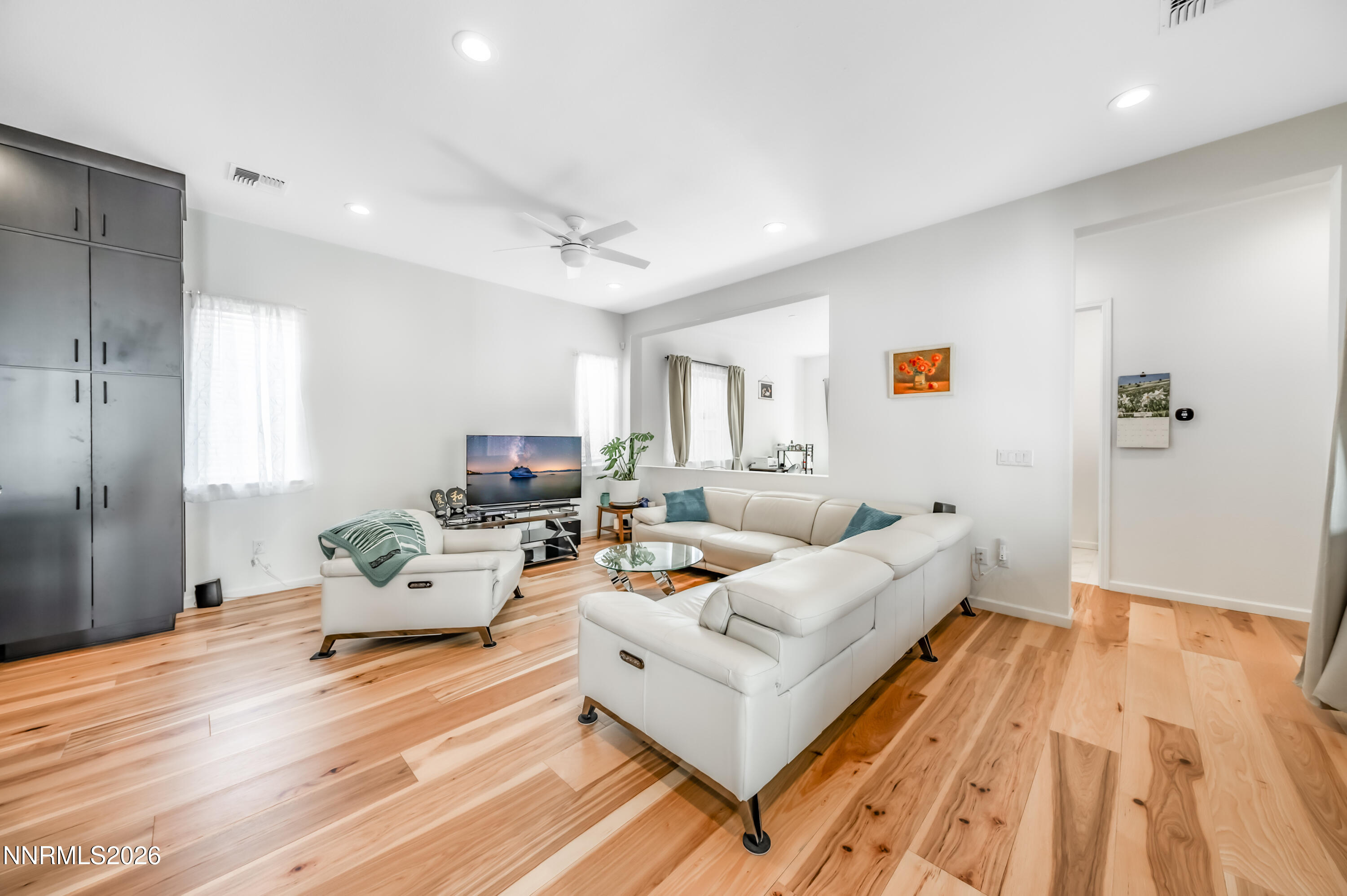 2402 Iron Square Drive Reno, NV 89521 - Photo 10 of 30 a living room with furniture and a wooden floor
