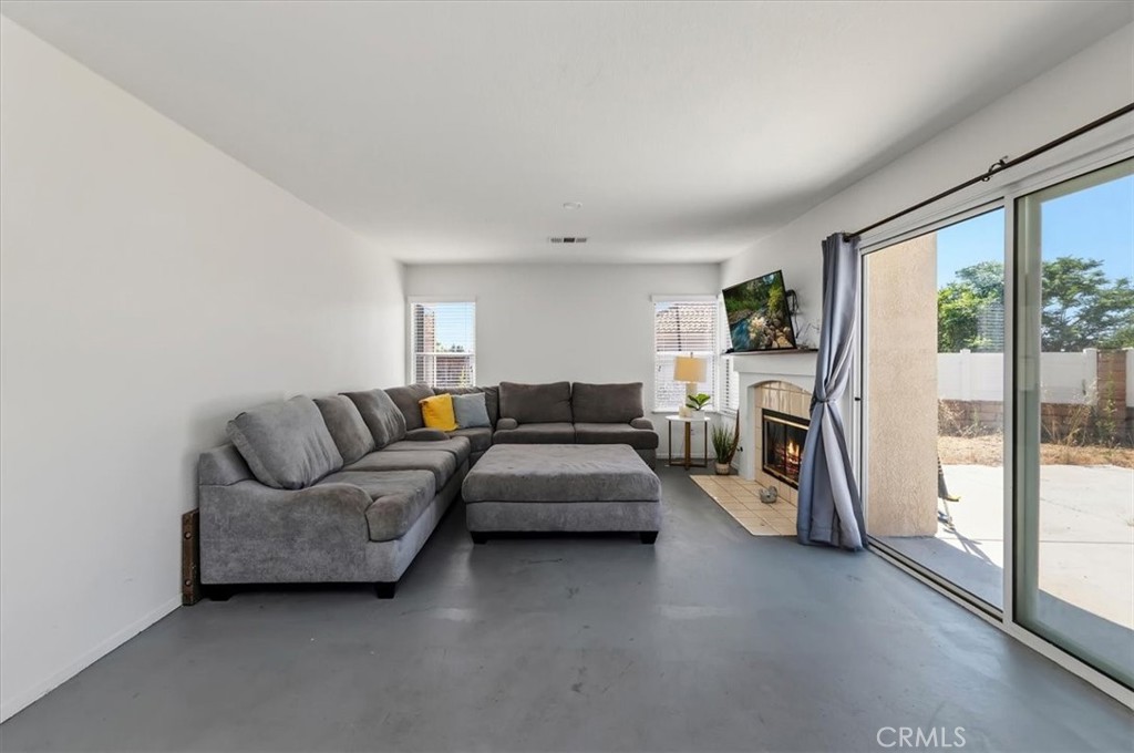 352 Leafwood Court Riverside, CA 92506 - Photo 34 of 42 a living room with furniture a large window and a rug