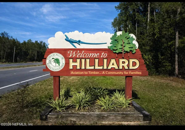 a sign that is on a pole on a wall