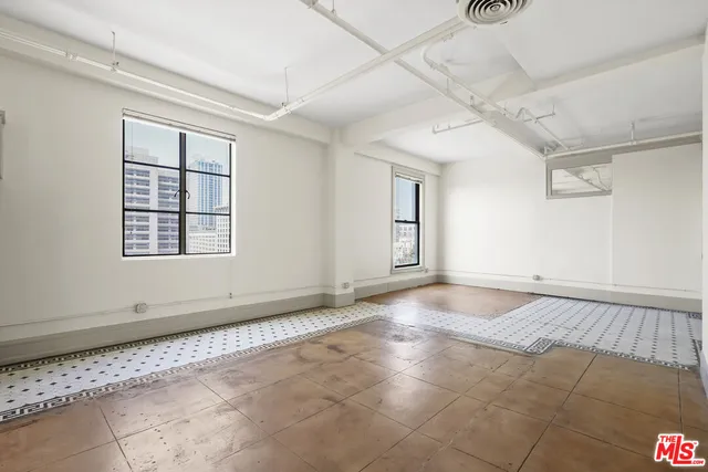 a kitchen with refrigerator cabinets and a sink