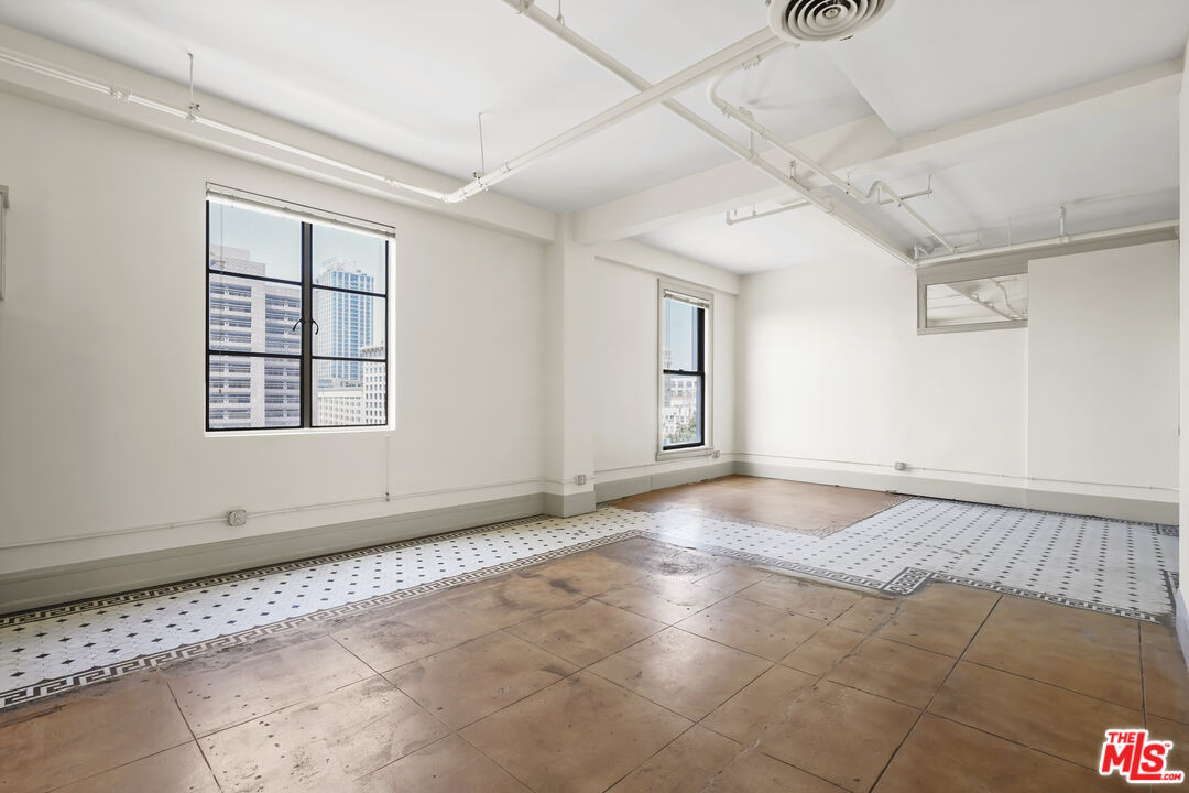108 West 2nd Street, Unit 708 Los Angeles, CA 90012 - Photo 11 of 40 a view of an empty room with a window