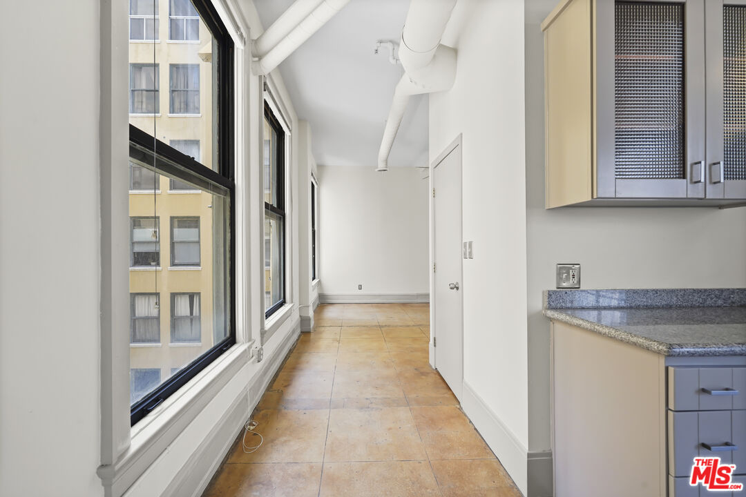108 West 2nd Street, Unit 708 Los Angeles, CA 90012 - Photo 19 of 40 a view of a bathroom with a granite countertop shower