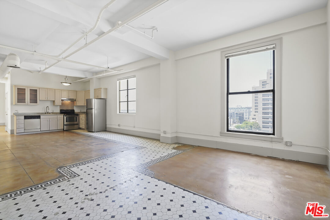 108 West 2nd Street, Unit 708 Los Angeles, CA 90012 - Photo 2 of 40 a view of an empty room with a window