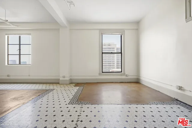 an empty room with windows