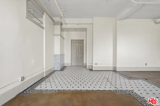 an empty room with a bench