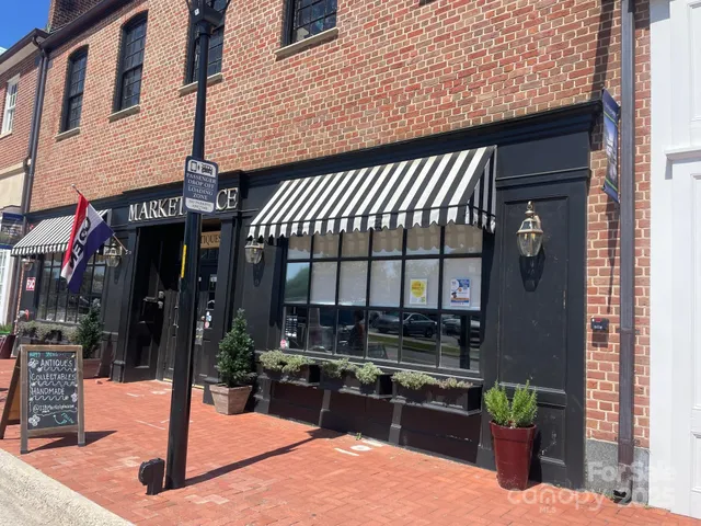 a view of a building with sitting area