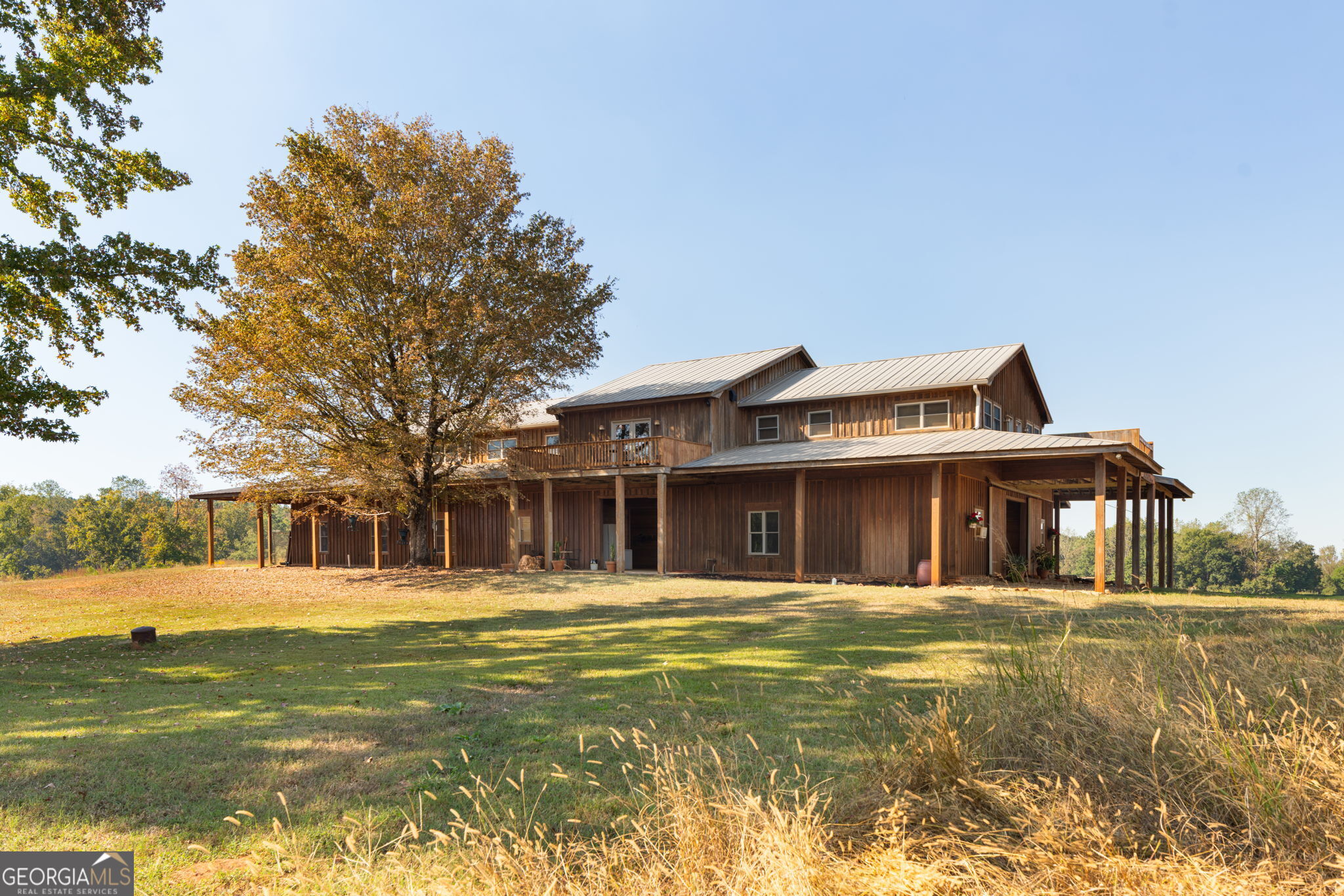 a front view of a building with a garden