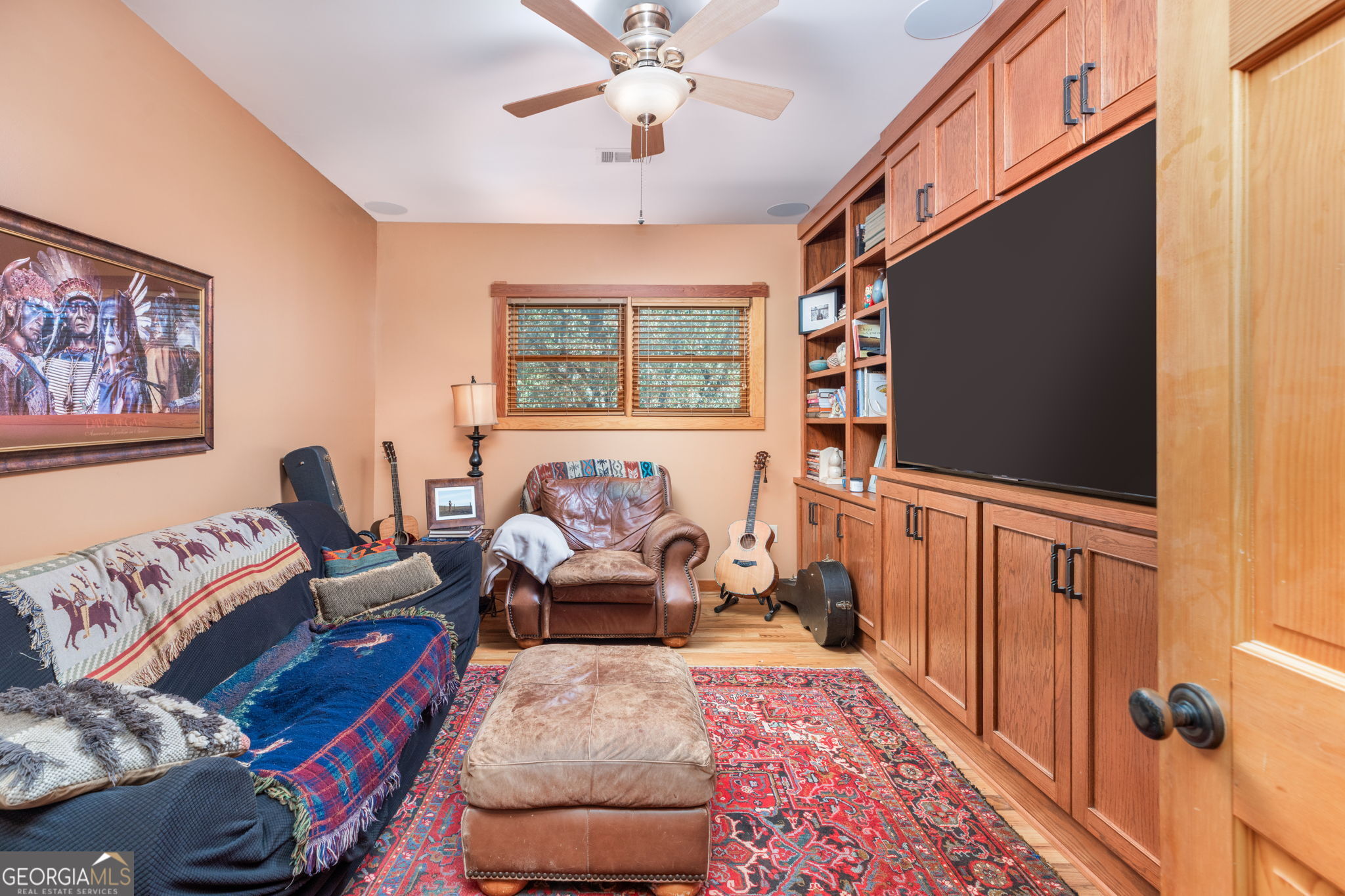 120 Torbet Road Forsyth, GA 31029 - Photo 106 of 118 a living room with furniture and a flat screen tv