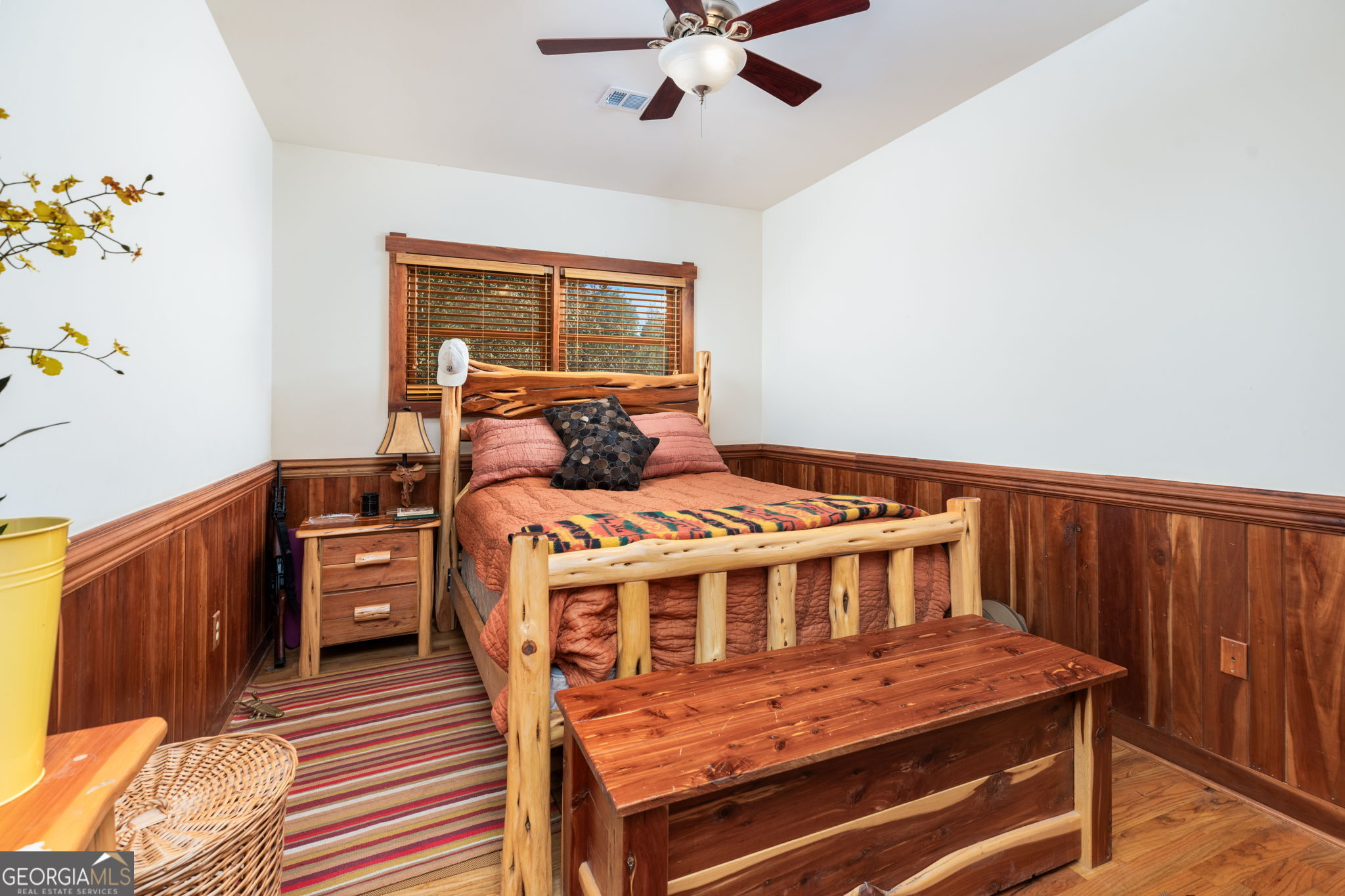 120 Torbet Road Forsyth, GA 31029 - Photo 107 of 118 a bedroom with a bed and wooden floor