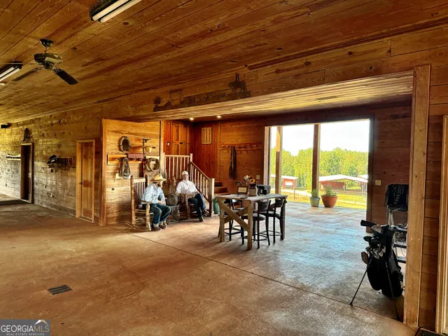 a view of a living room with furniture and a flat screen tv