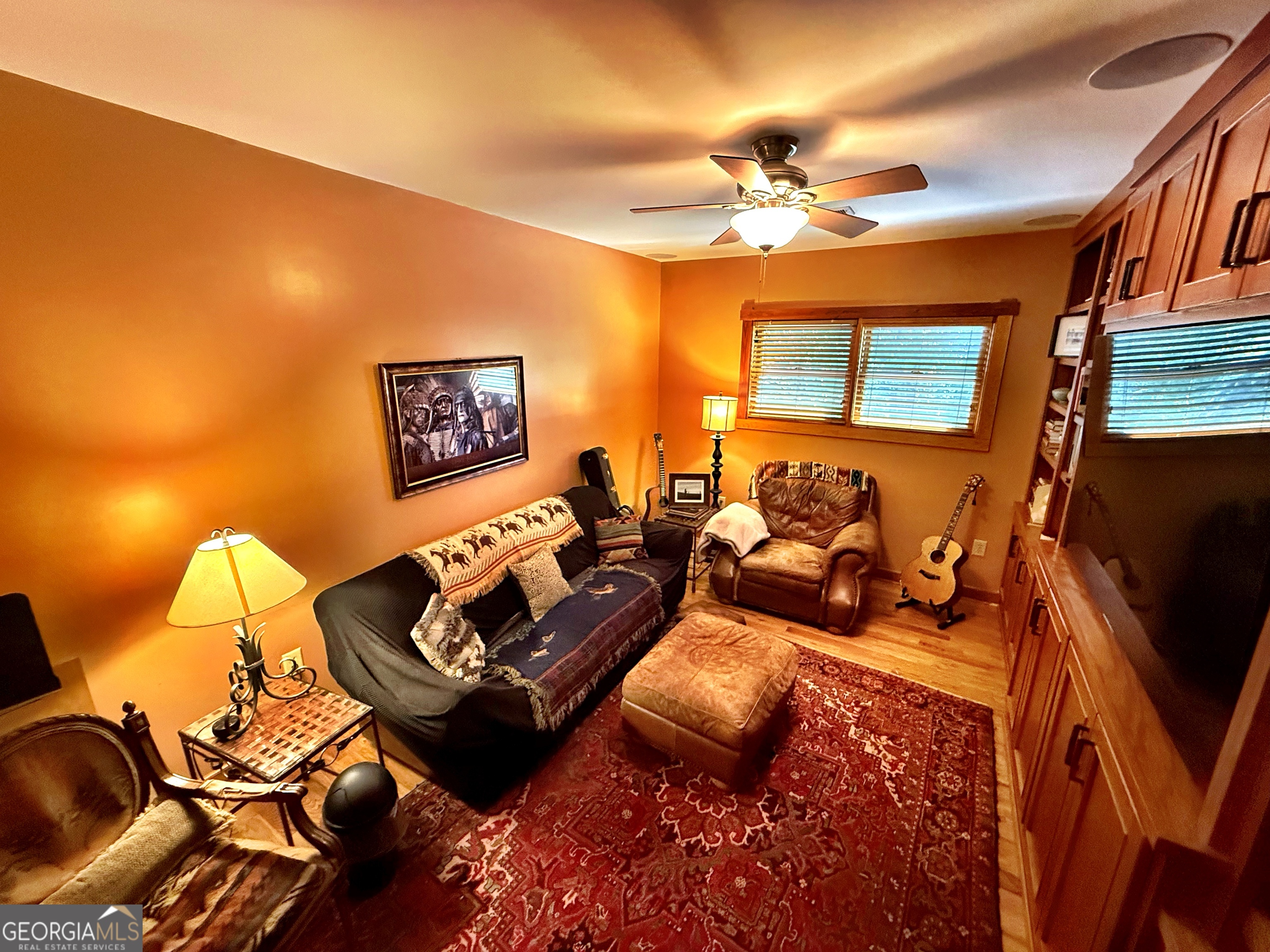 120 Torbet Road Forsyth, GA 31029 - Photo 23 of 118 a living room with furniture and a flat screen tv