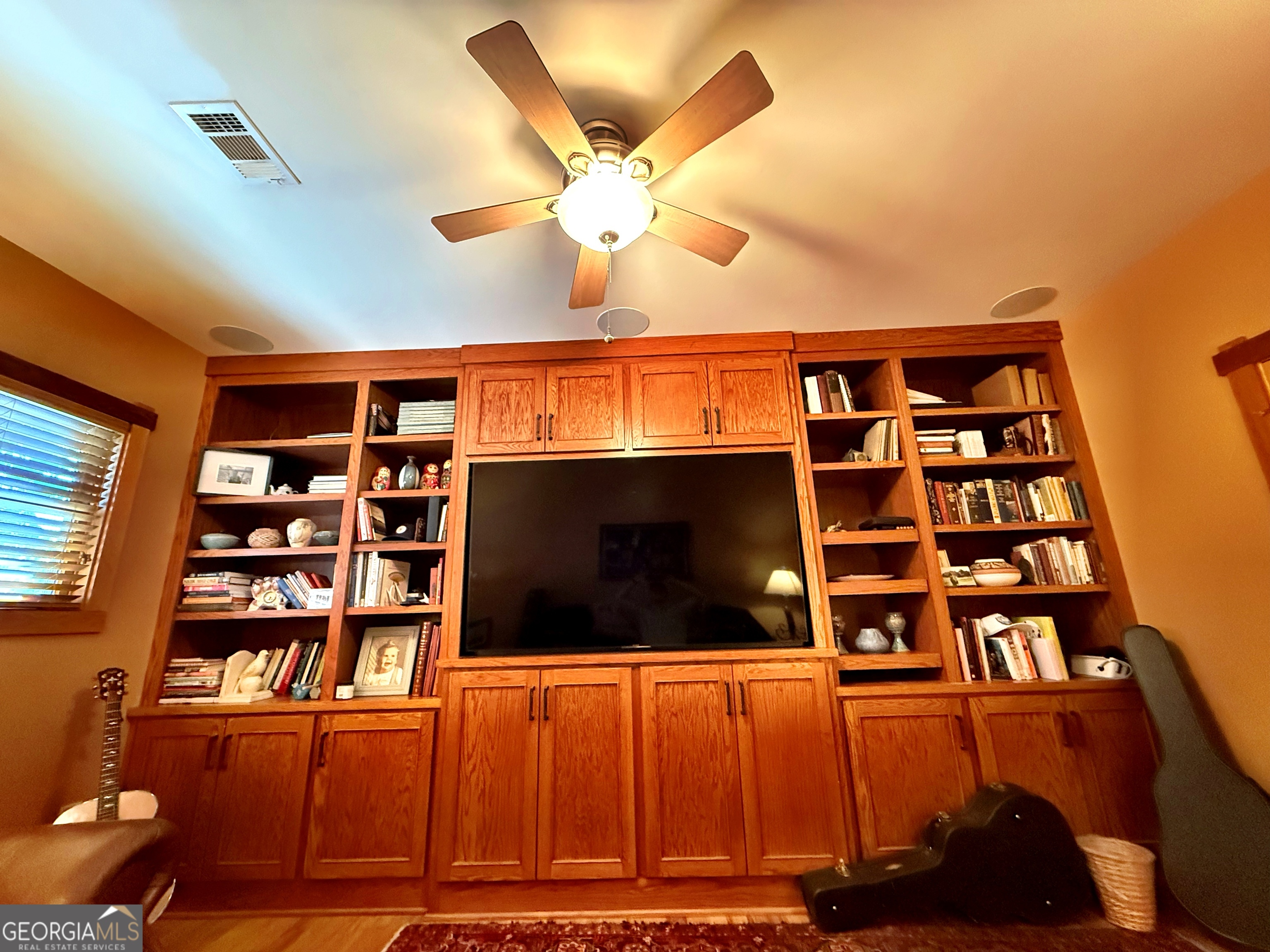 120 Torbet Road Forsyth, GA 31029 - Photo 24 of 118 a view of a living room with furniture and a flat screen tv