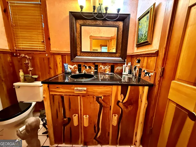 a balcony with table and chairs