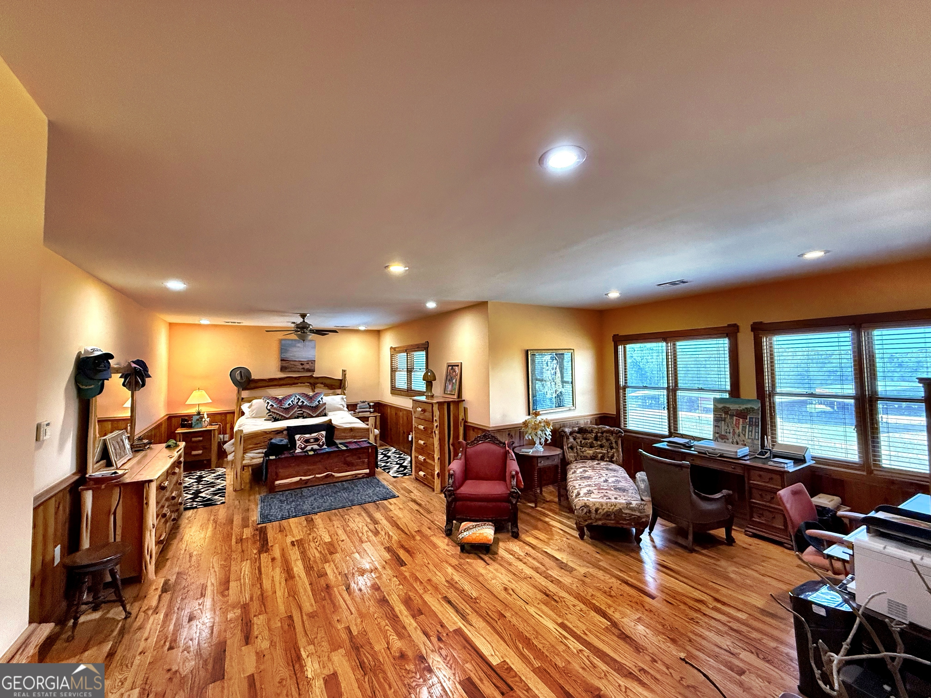 120 Torbet Road Forsyth, GA 31029 - Photo 29 of 118 a very nice looking living room with furniture a large window and a wooden floor